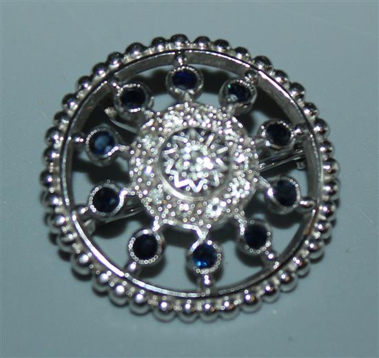 Circular platinum gem set brooch